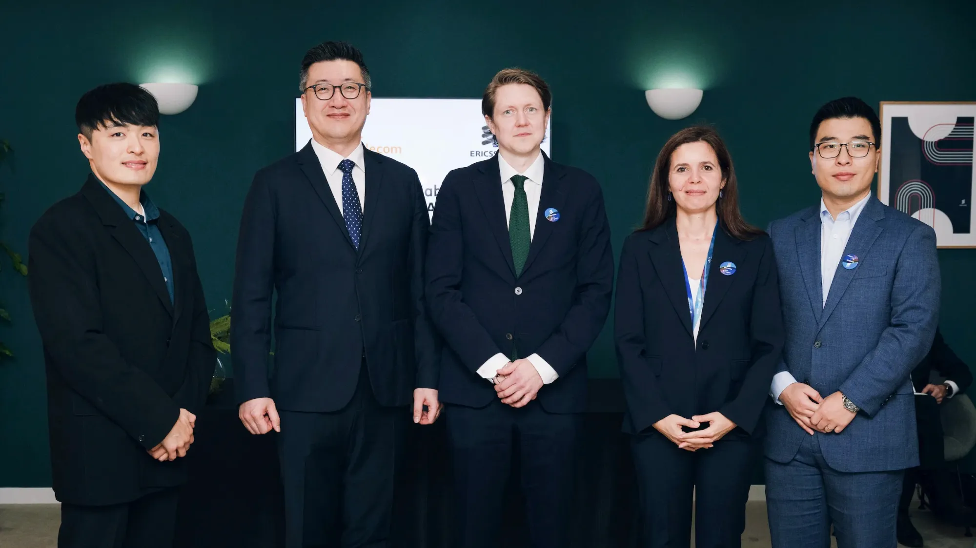 SK Telecom and Ericsson executives pose for a commemorative photo following the MoU signing on March 19, 2026. (From left) Second: Yu Takki, Head of Network Technology at SK Telecom; Third: Mårten Lerner, Head of Networks Strategy and Product Management at Ericsson; Fourth: Sibel Tombaz, CEO of Ericsson Korea. ⓒSK Telecom